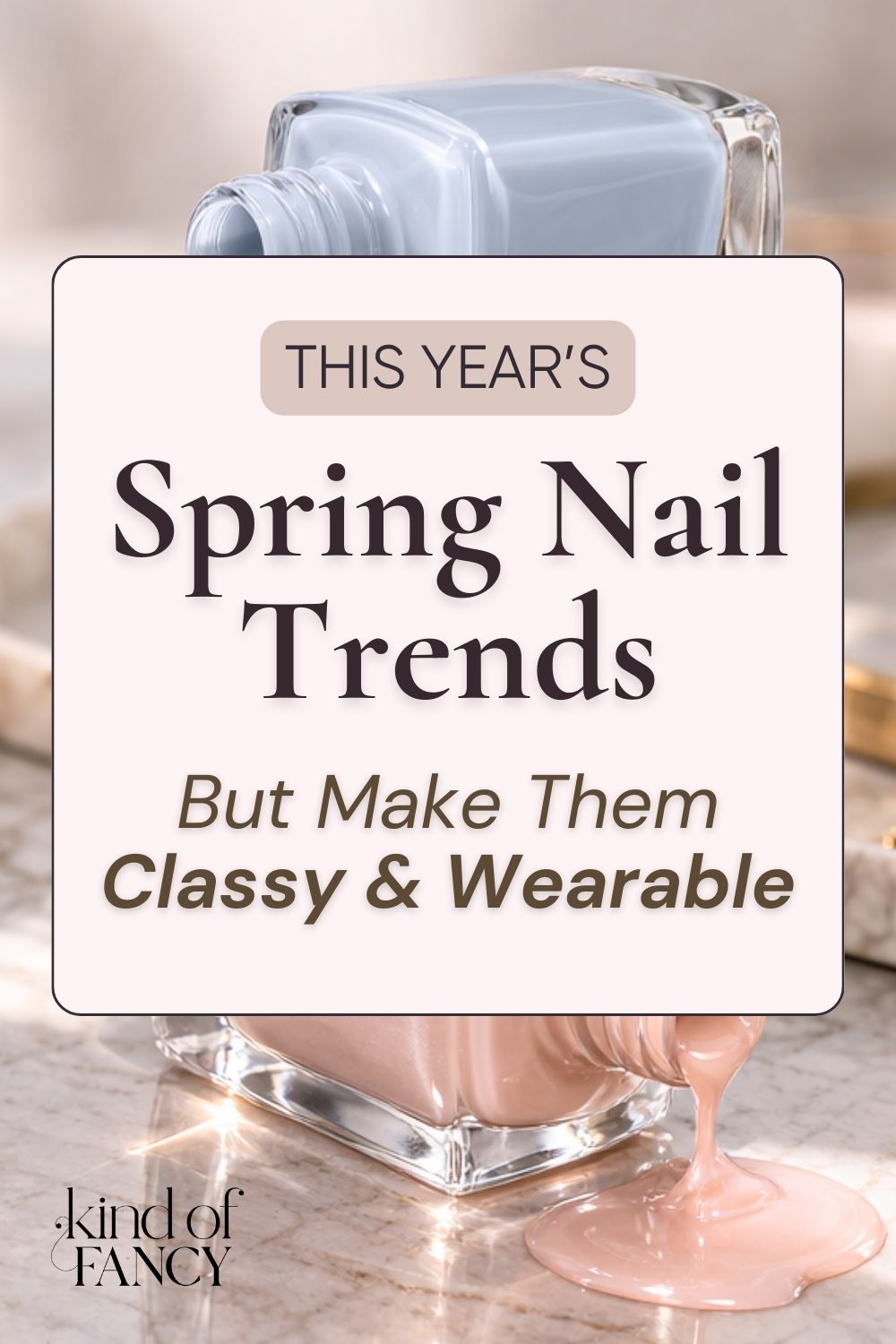 Wearable spring nail trends that are classy and fresh. This copy is against a beautiful vanity with open nail polish bottles in icy blue and warm opalescent pink shown in soft, diffused light.