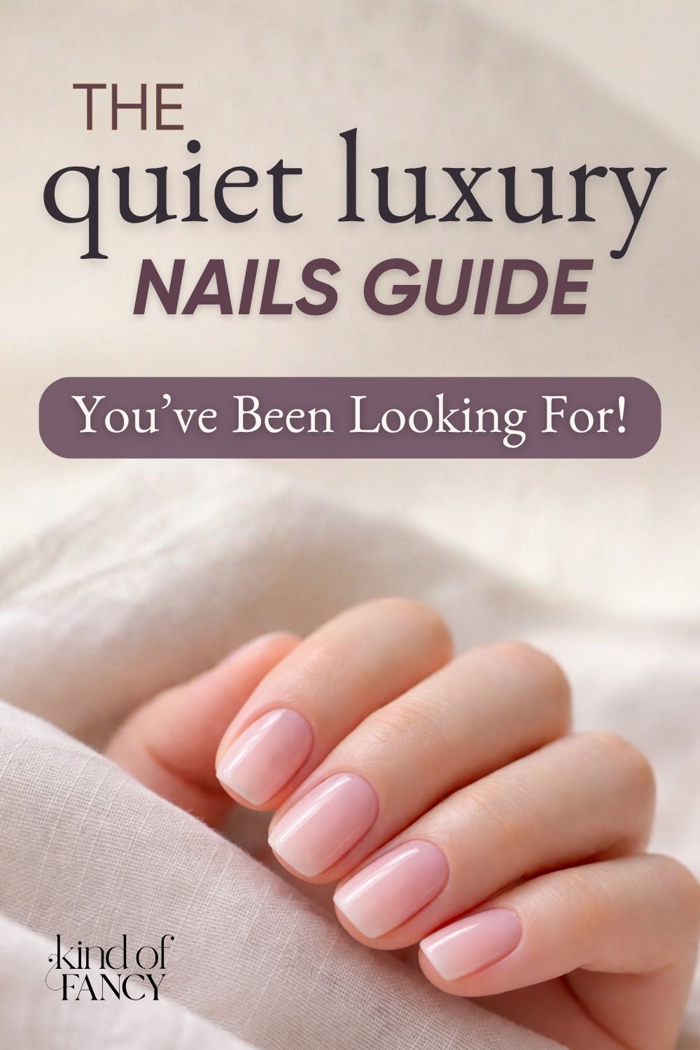 Closeup of woman's hand with milky pink quiet luxury nails manicure.