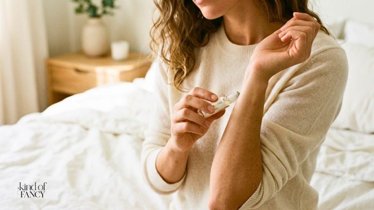 best skin scent perfumes being applied to a woman's wrist in a minimalist bedroom.